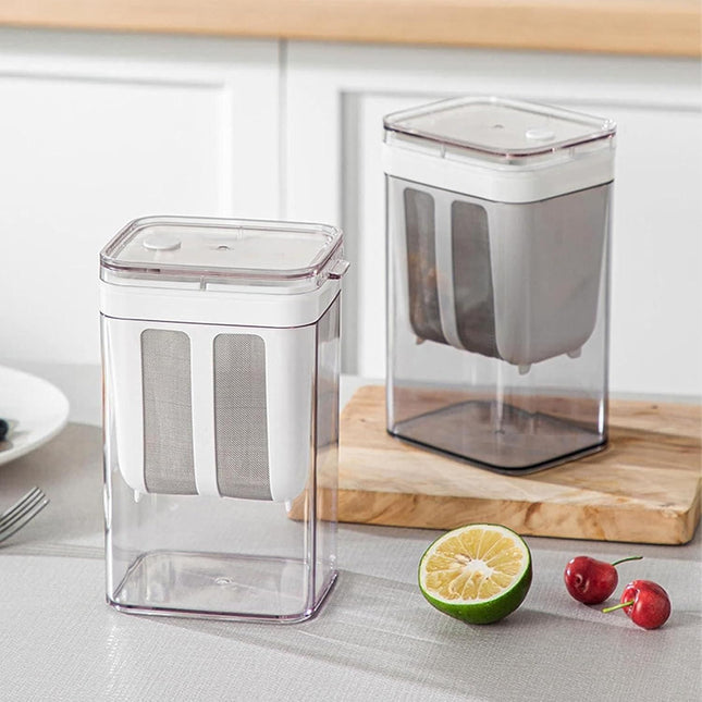 Two clear storage containers with lids on a kitchen counter with a lime and cherries.